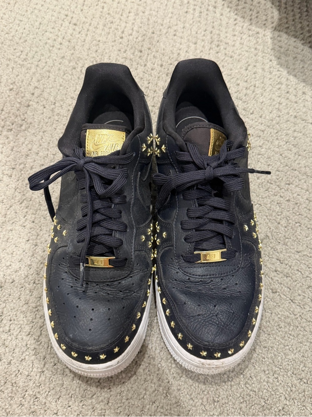 Nike Black Low-Top Sneakers with Gold Stud Accents